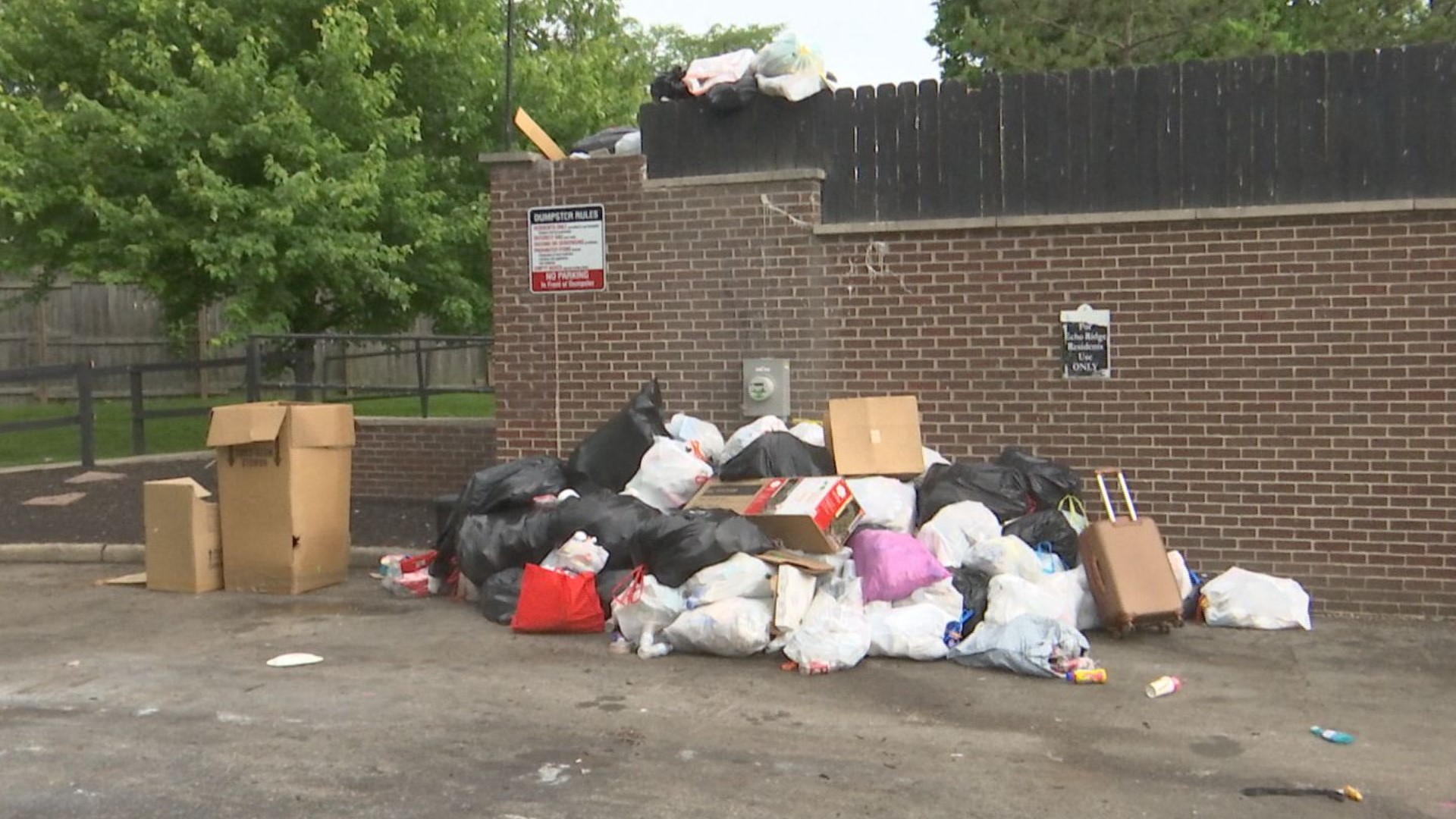 Residents decry overflowing dumpsters at apartment complex