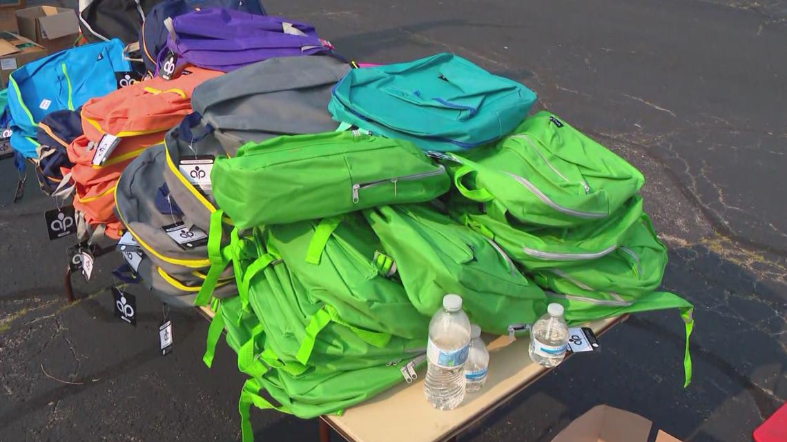 IPS parents pick up free backpacks amid questions about school year