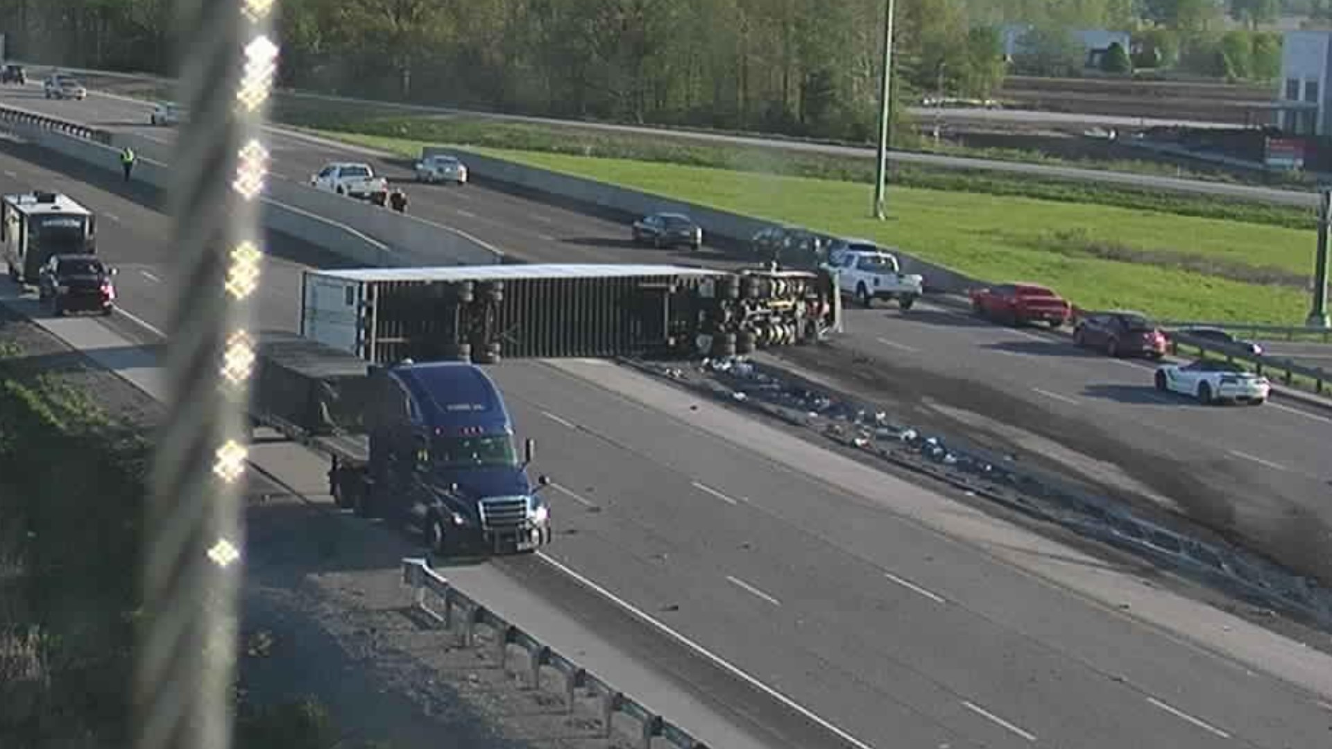 The semi rolled across the inside lanes of northbound and southbound I-65 on the bridge over State Road 44.