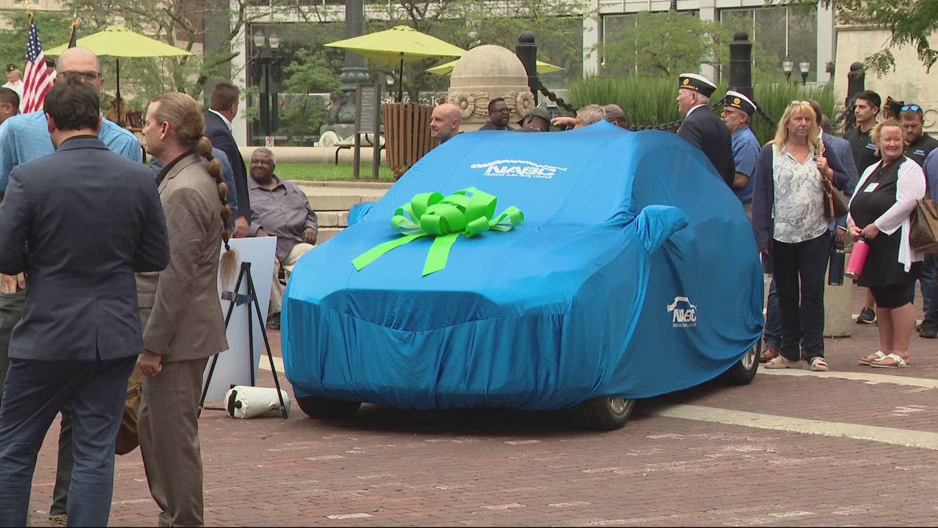 Two refurbished cars were delivered to veterans in a ceremony on Monument Circle Tuesday.