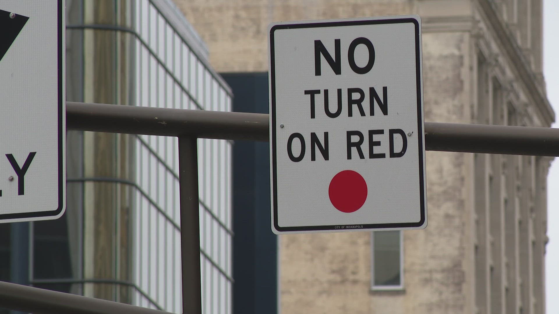 13News reporter Gina Glaros shows how new no-turn-on-red signs are being installed all over Indianapolis.