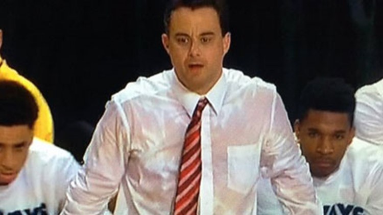 Arizona basketball coach drenched in sweat 