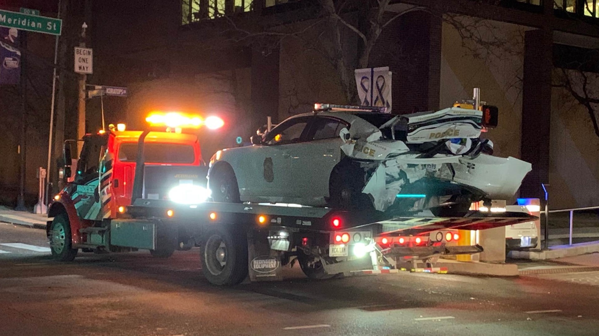 The crash occurred when another driver hit an officer's vehicle from behind at the intersection of  30th and North Meridian streets, police said.