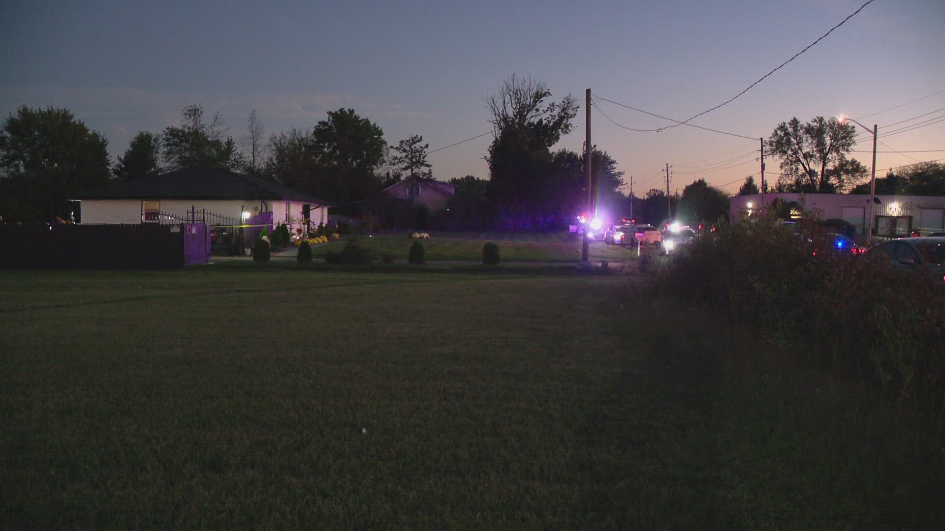 13News reporter Anna Chalker talks with a local domestic violence advocate following a murder-suicide on Indy's east side Thursday evening.