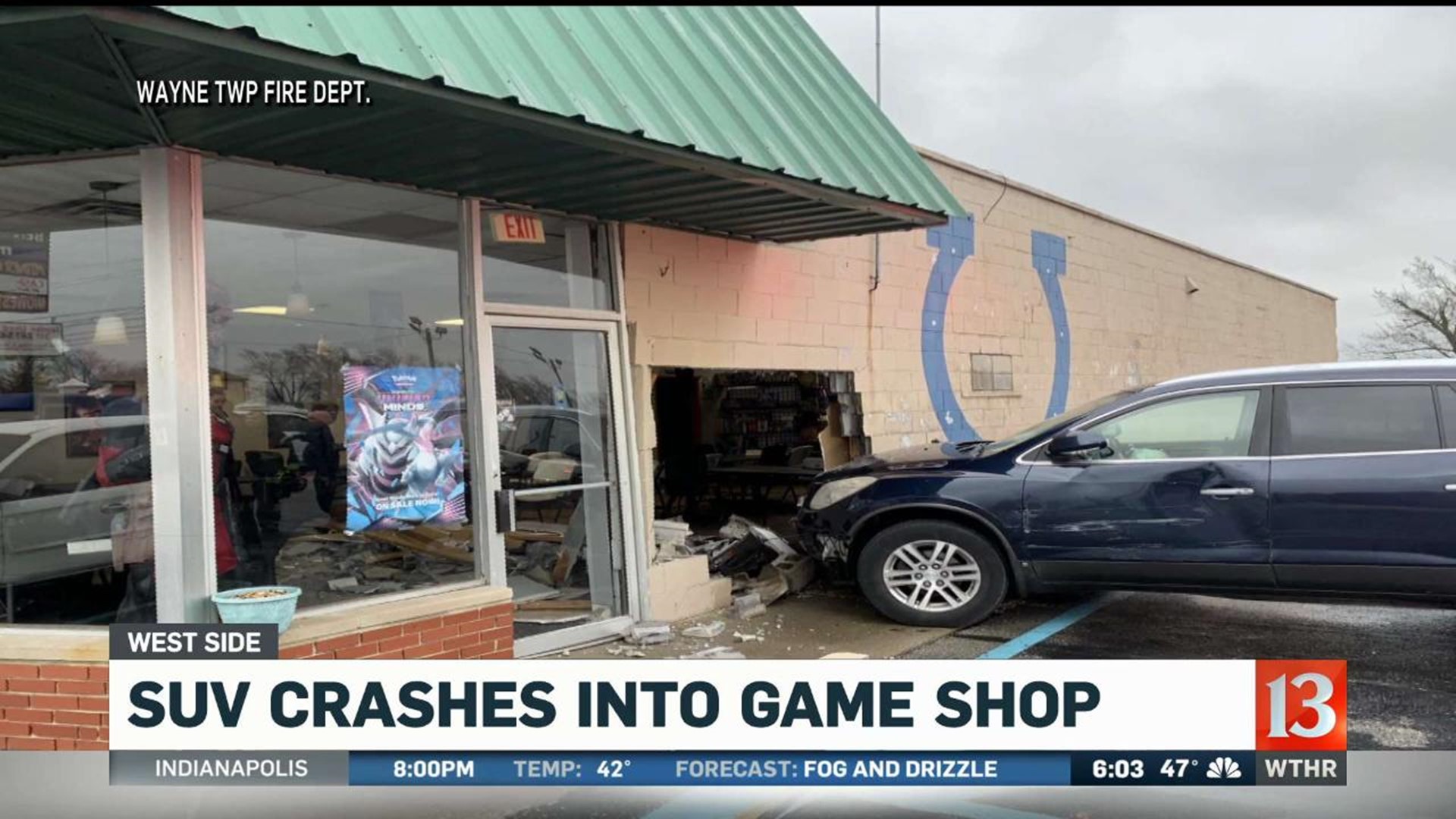 SUV crashes into game shop