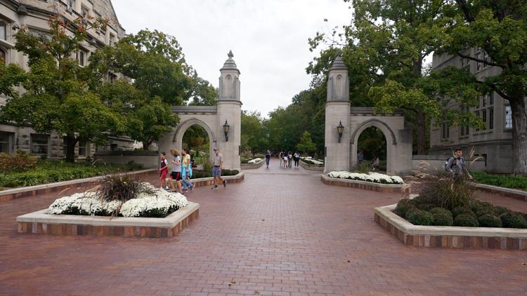 Indiana University cuts 25 jobs in preparation for revenue sharing, AP source says