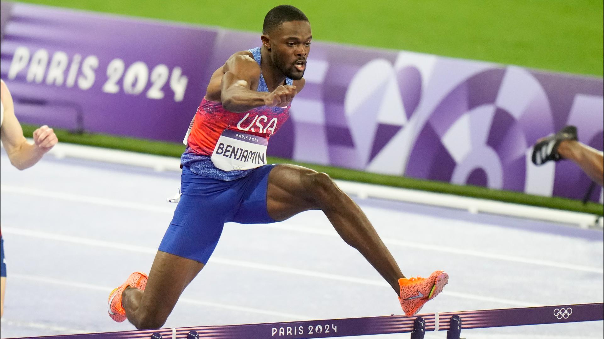 Rai Benjamin, of the United States, wins the men's 400-meter hurdles past Karsten Warholm, of Norway, at the 2024 Summer Olympics.