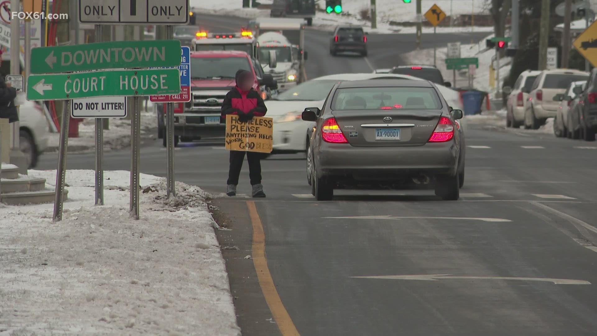 The signs said, "Say no to panhandling. There are better ways to give."