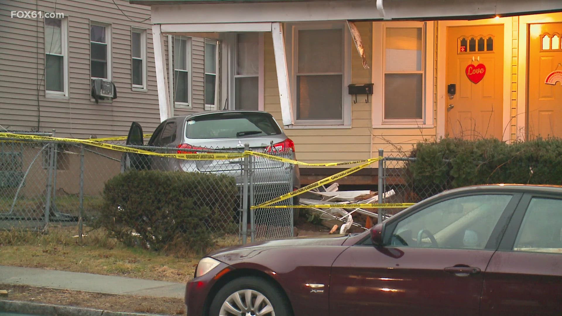 The driver of a car that crashed into the front porch of a home in Hartford was taken to the hospital for her injuries, the fire department said.