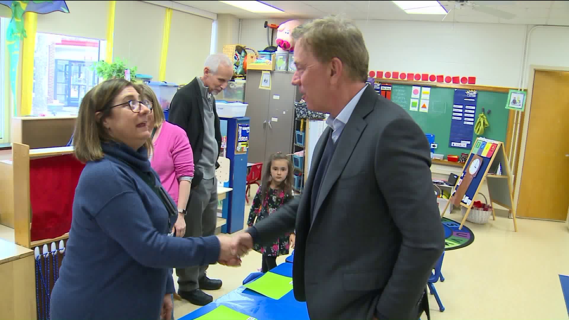 Lamont tours school to push for reform