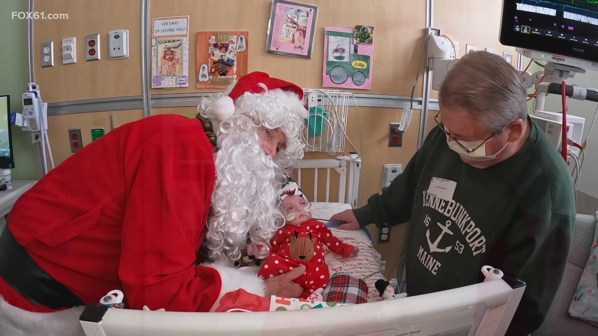 Dr. Doug MacGilpin is making his rounds to greet kids and their parents at Connecticut Children's. This year, he is going exclusively as Santa to drop off toys.