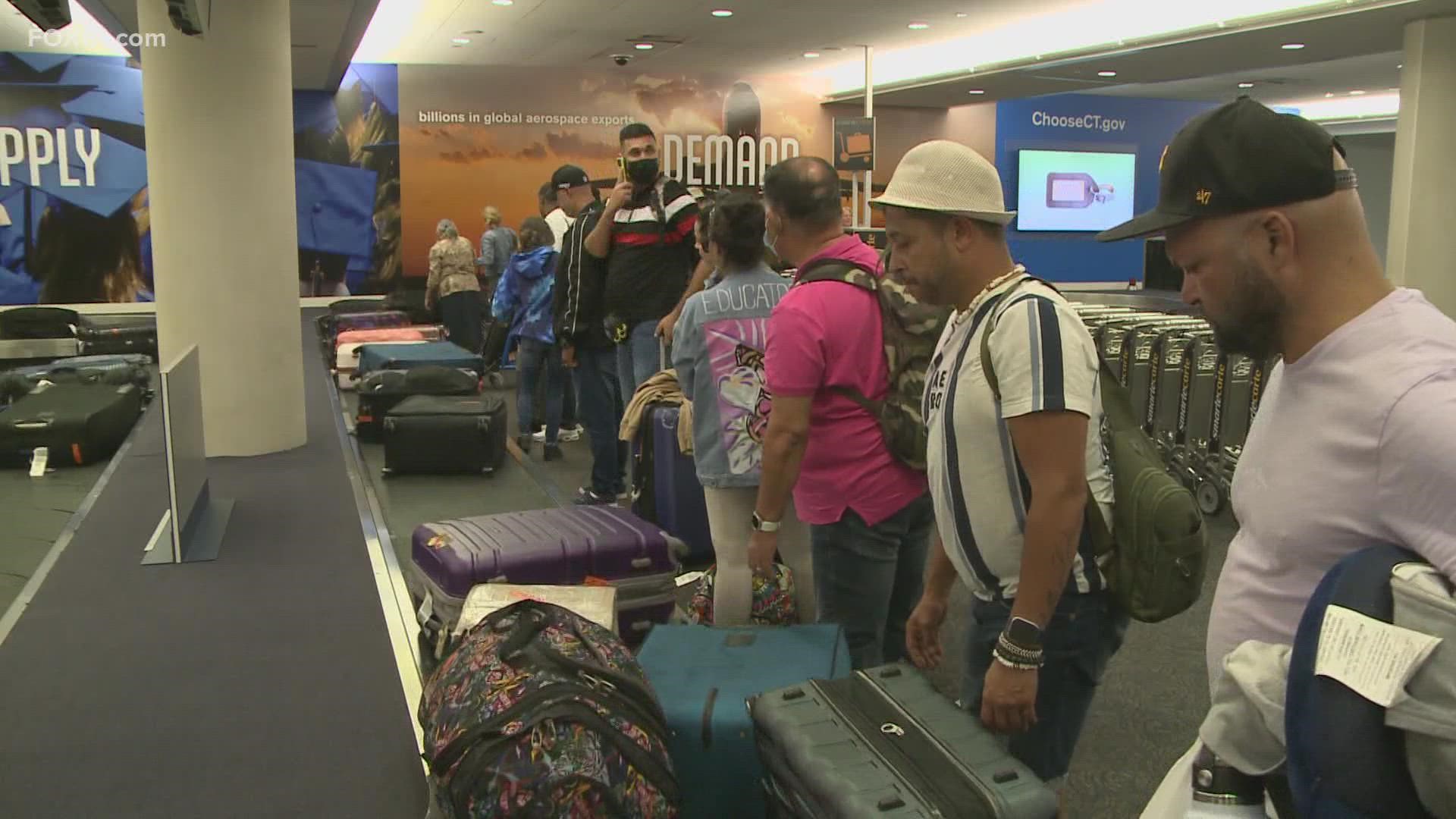 Dozens of people landed at Bradley International Airport Monday evening after departing from Puerto Rico, which is now recovering from Hurricane Fiona.