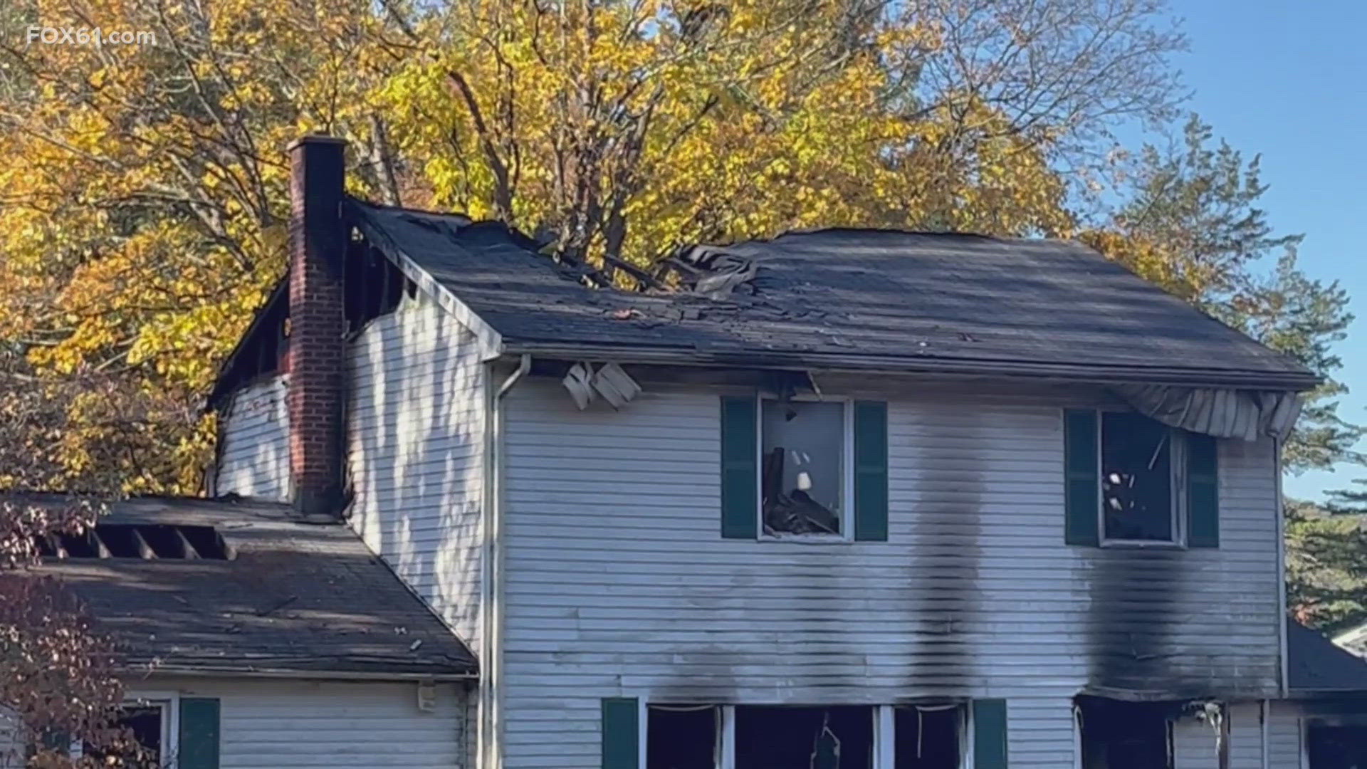 A fire in Cheshire early Friday morning is under investigation. Four people and a dog were inside the house went it went ablaze. Two people were hurt.