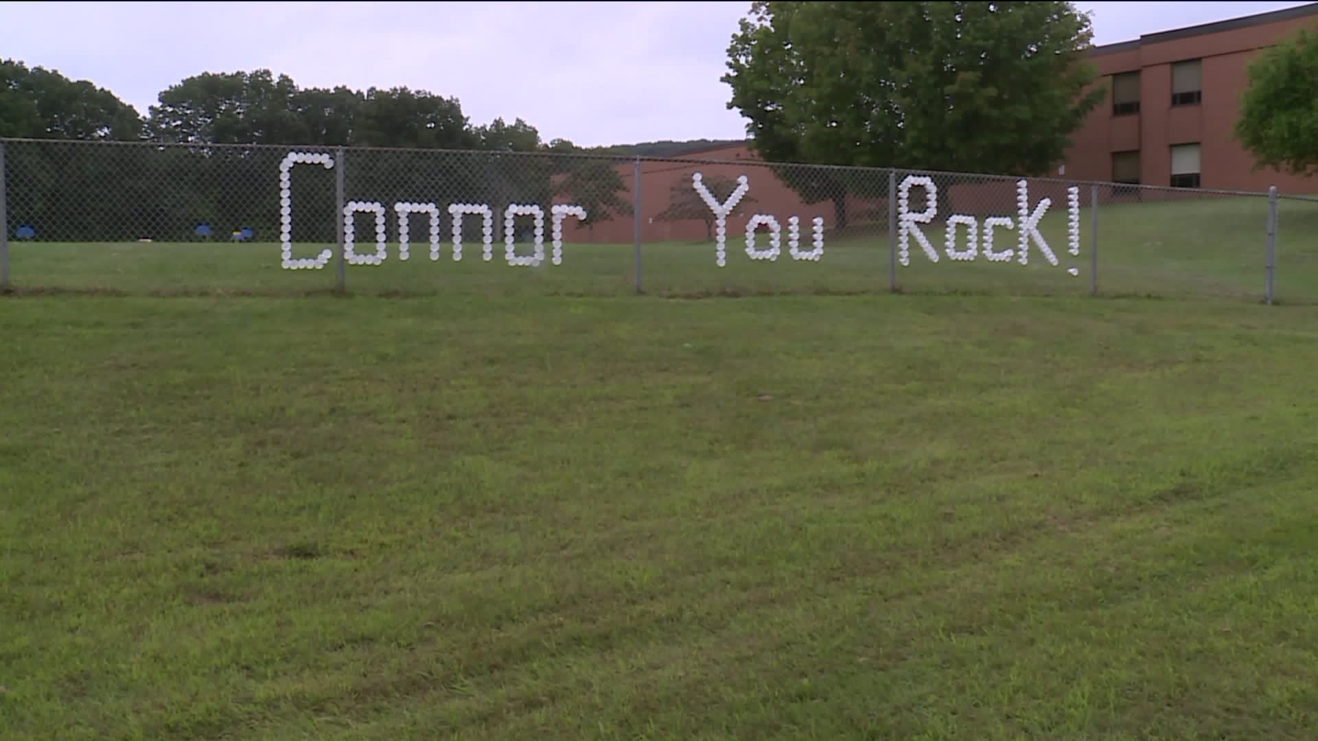 Cups for Connor: Messages of hope in a Bristol fence