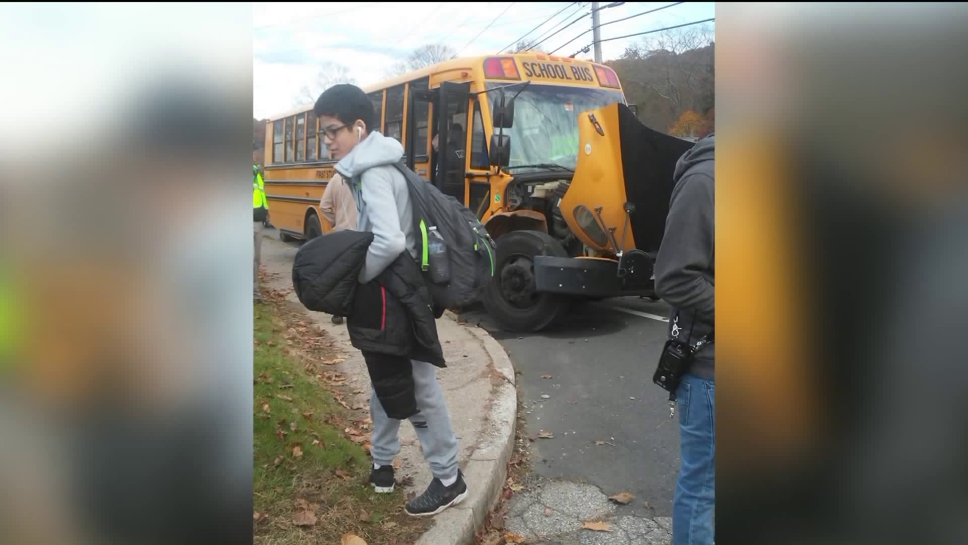 Distracted driver collides head on with school bus in Ansonia