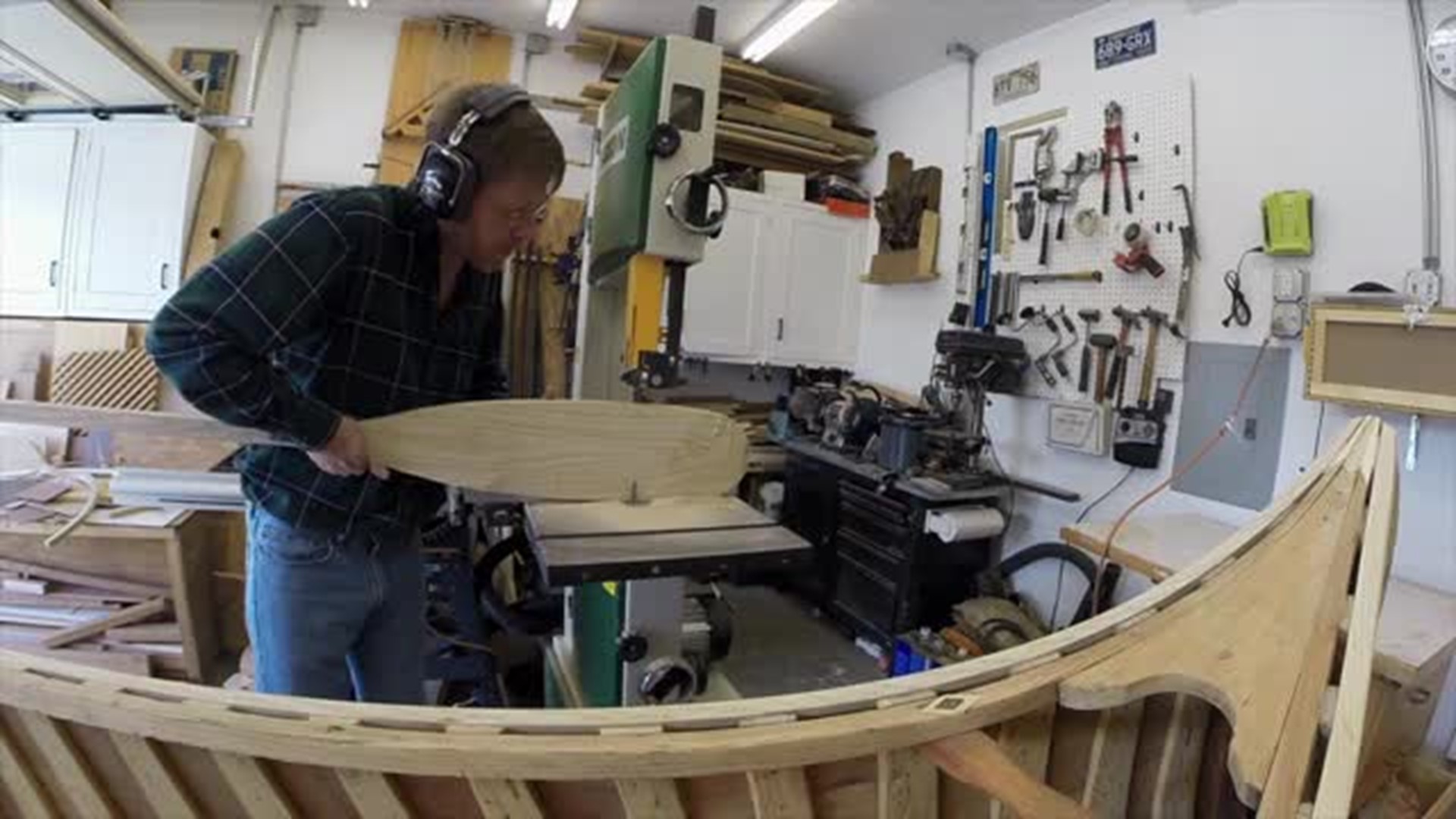 Restoring his father's canoe