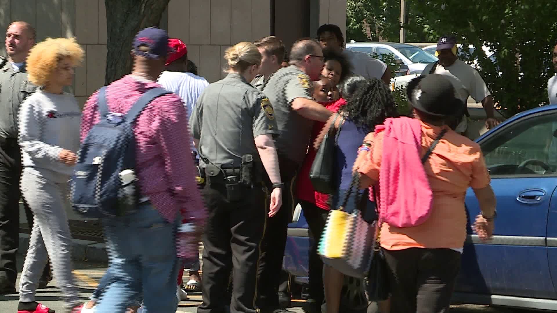 Murder suspect arraigned in Hartford; Families in shouting match outside court....