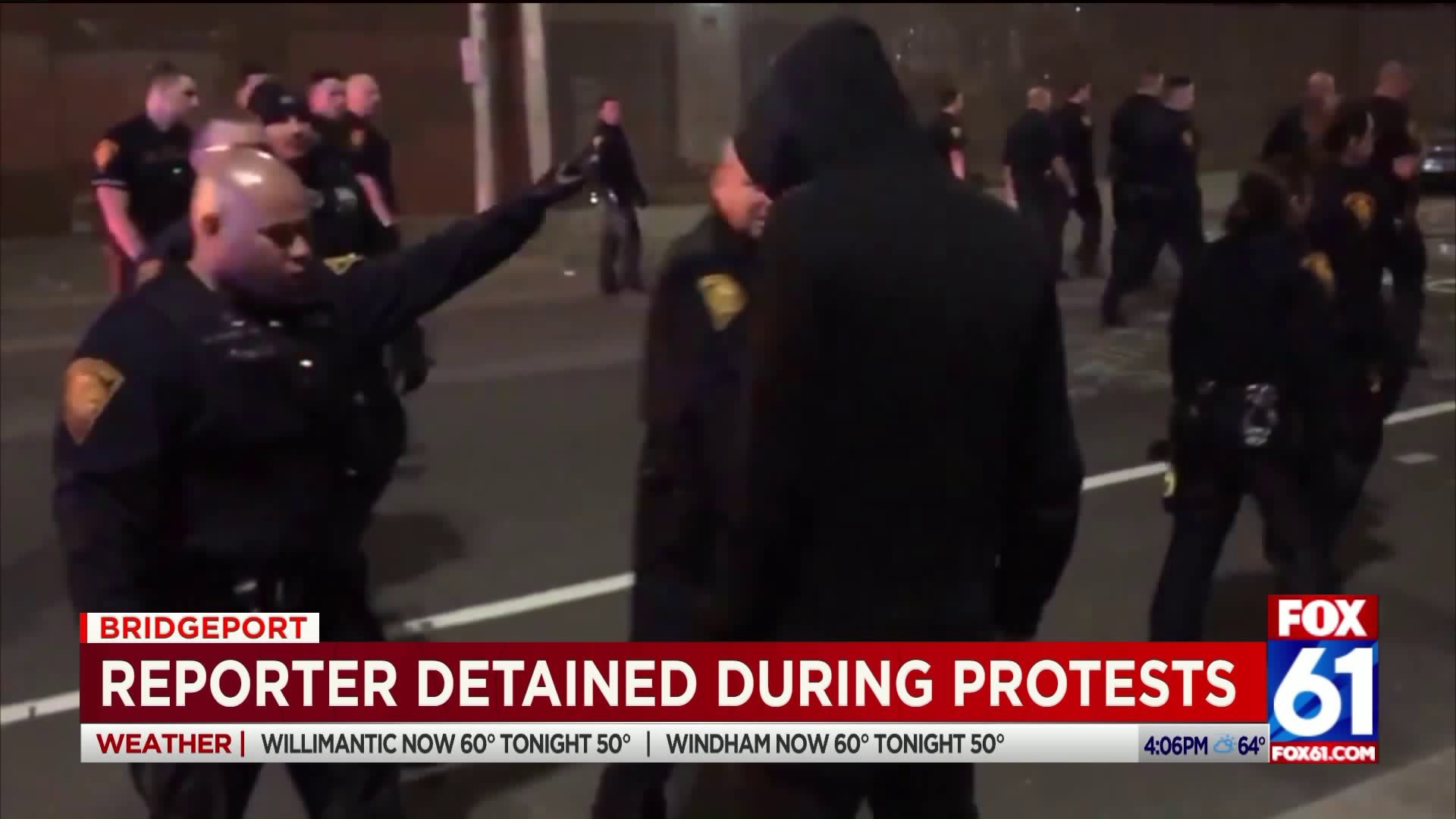 Reporter detained during confrontation