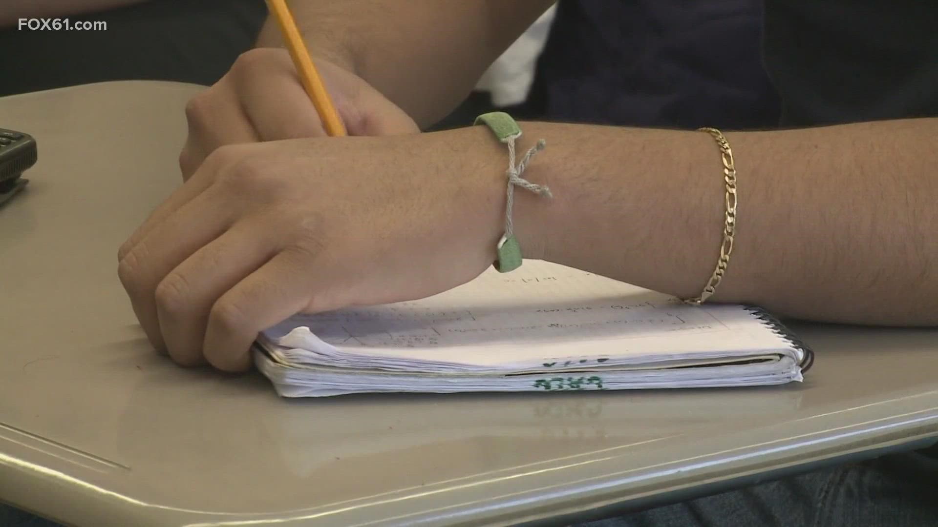 The program requires students to lock up their cell phones in a pouch until the end of the school day.