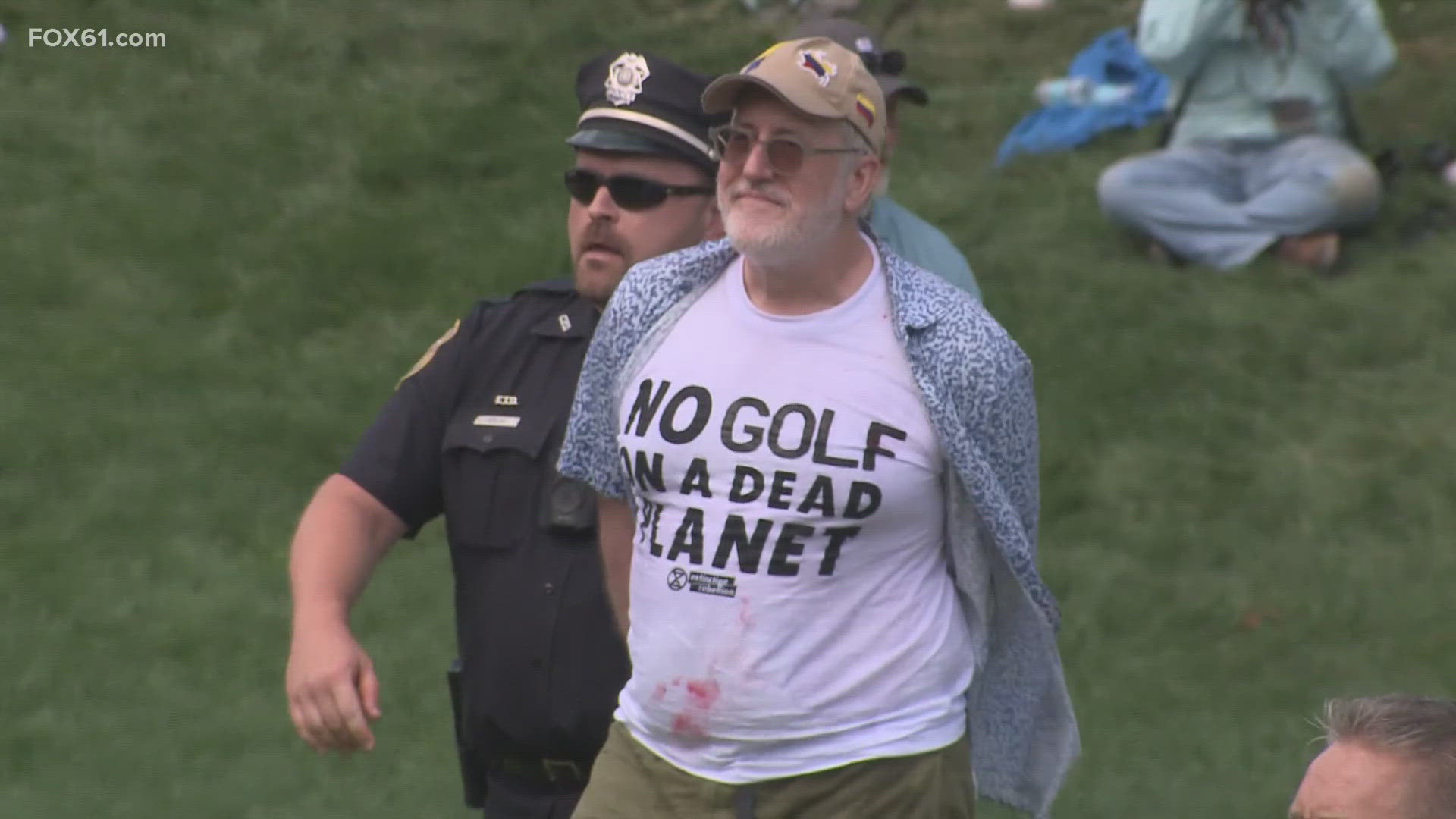 Six people were arrested for storming 18 as Kim and Scheffler were battling for the Travelers Championship title.