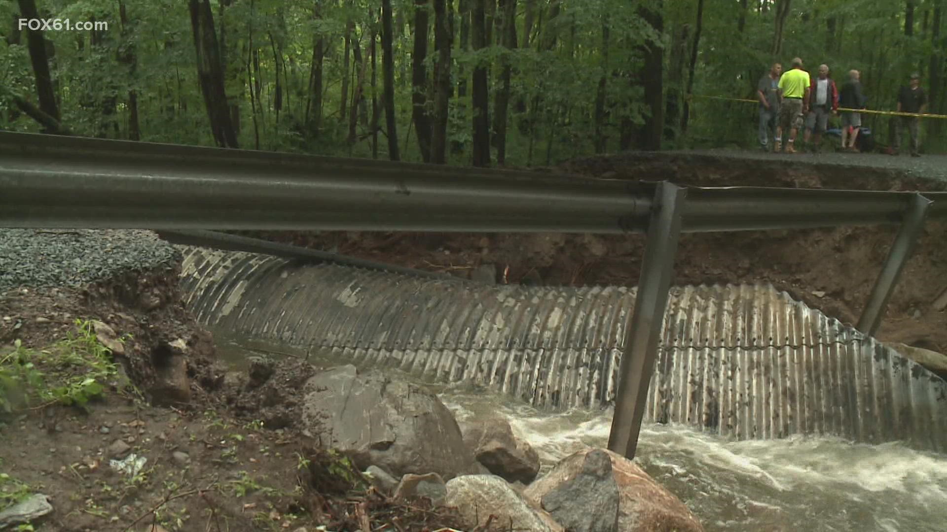 Rushing water quickly clogged debris in a rusty 40-year-old culvert, which gave way, and took the access road with it.