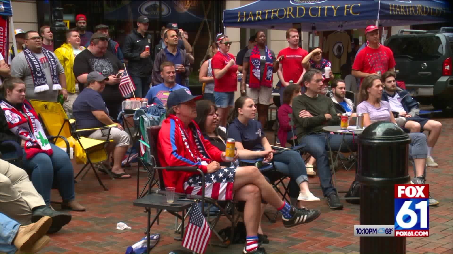 Fans cheering on the Women`s soccer team in Hartford