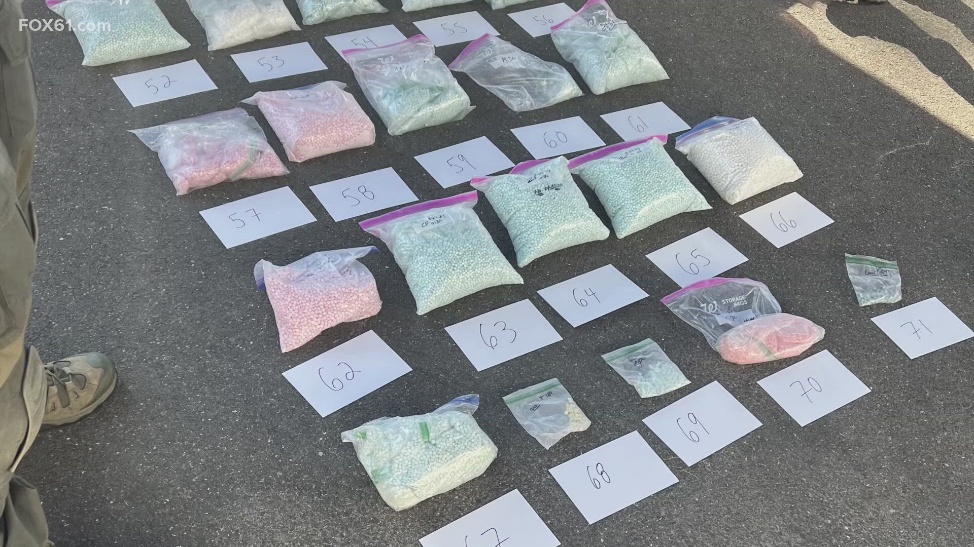 U.S. attorneys allege the operation ran out of a rented garage in East Haven, where hundreds of thousands of counterfeit pills were seized by federal agents.