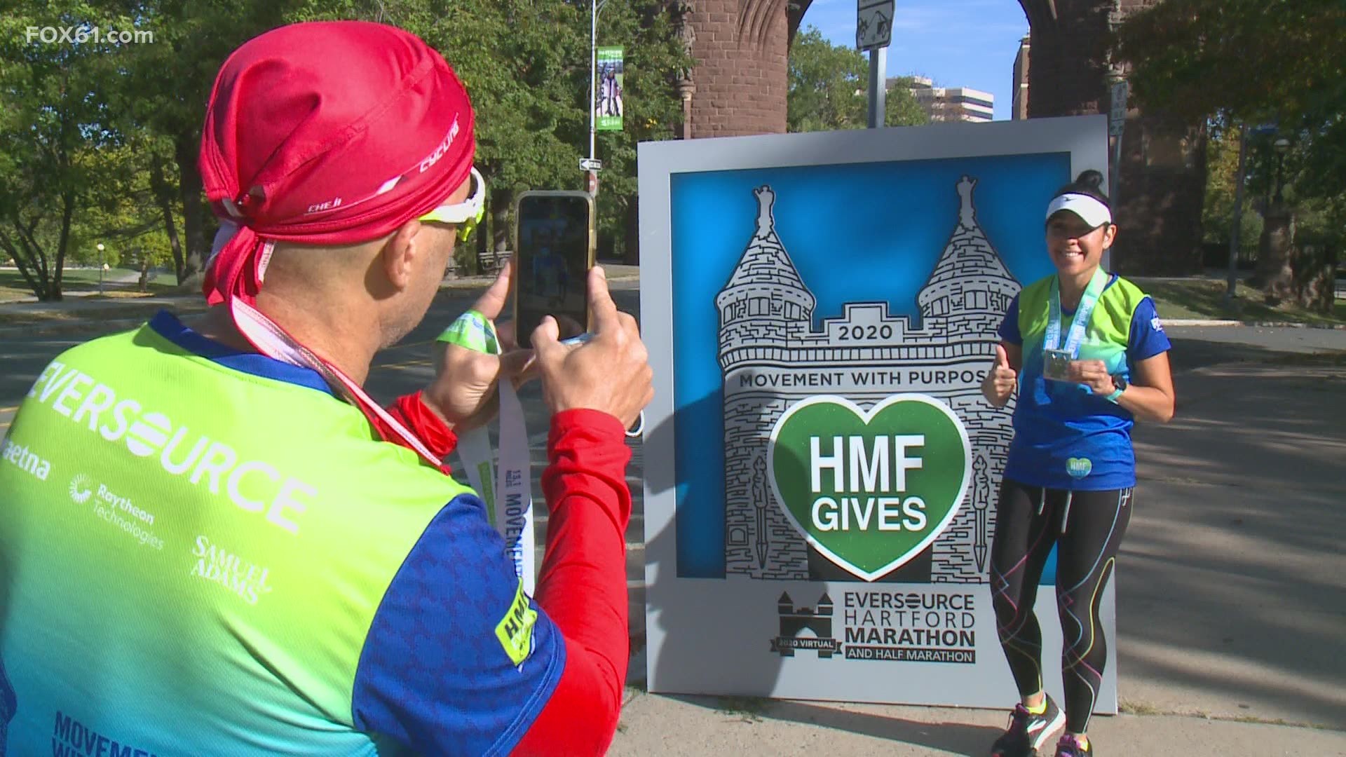 At popular running spots around CT, people participated in the "mobile medal" experience, taking pictures at their own finish lines while supporters cheered them on.