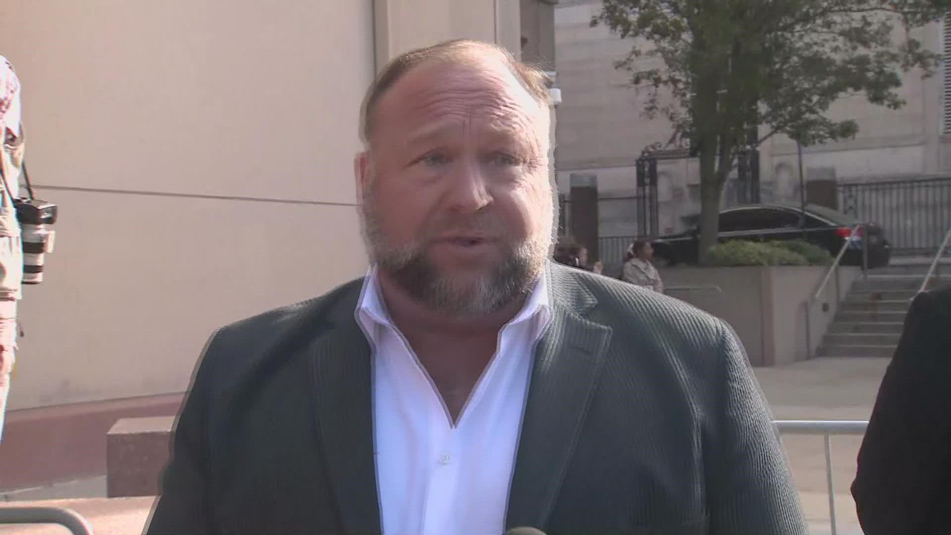 Alex Jones spoke to the media before walking into Waterbury Superior Court on Friday, as he is expected to continue testimony in his defamation trial.