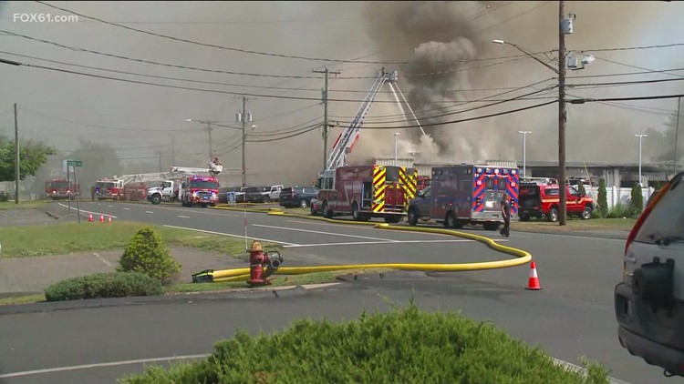 Enfield auto dealership heavily damaged in fire; 2 people injured