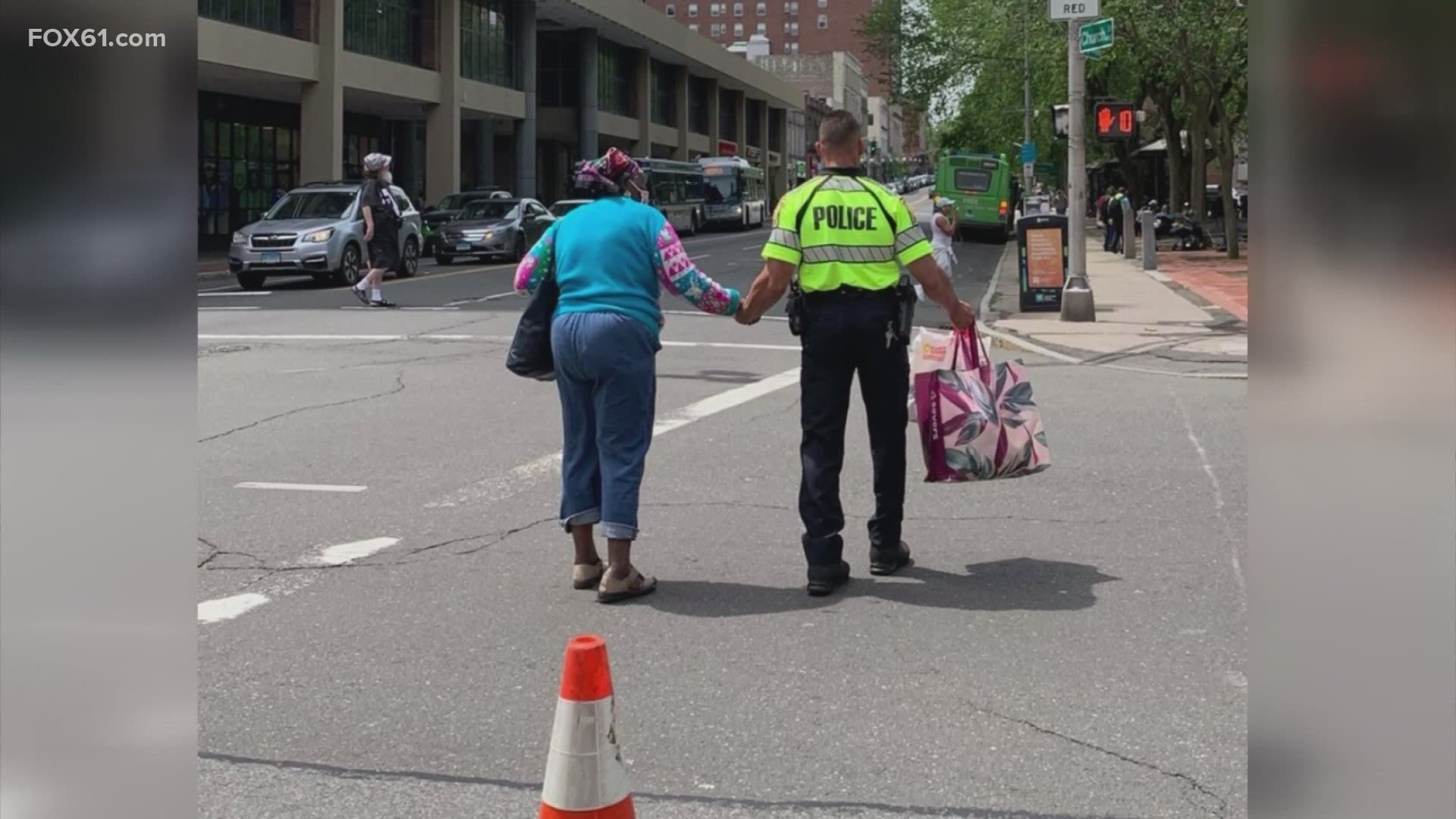Workers from the Regional Water Authority posted a picture of the officer helping a woman cross the street.