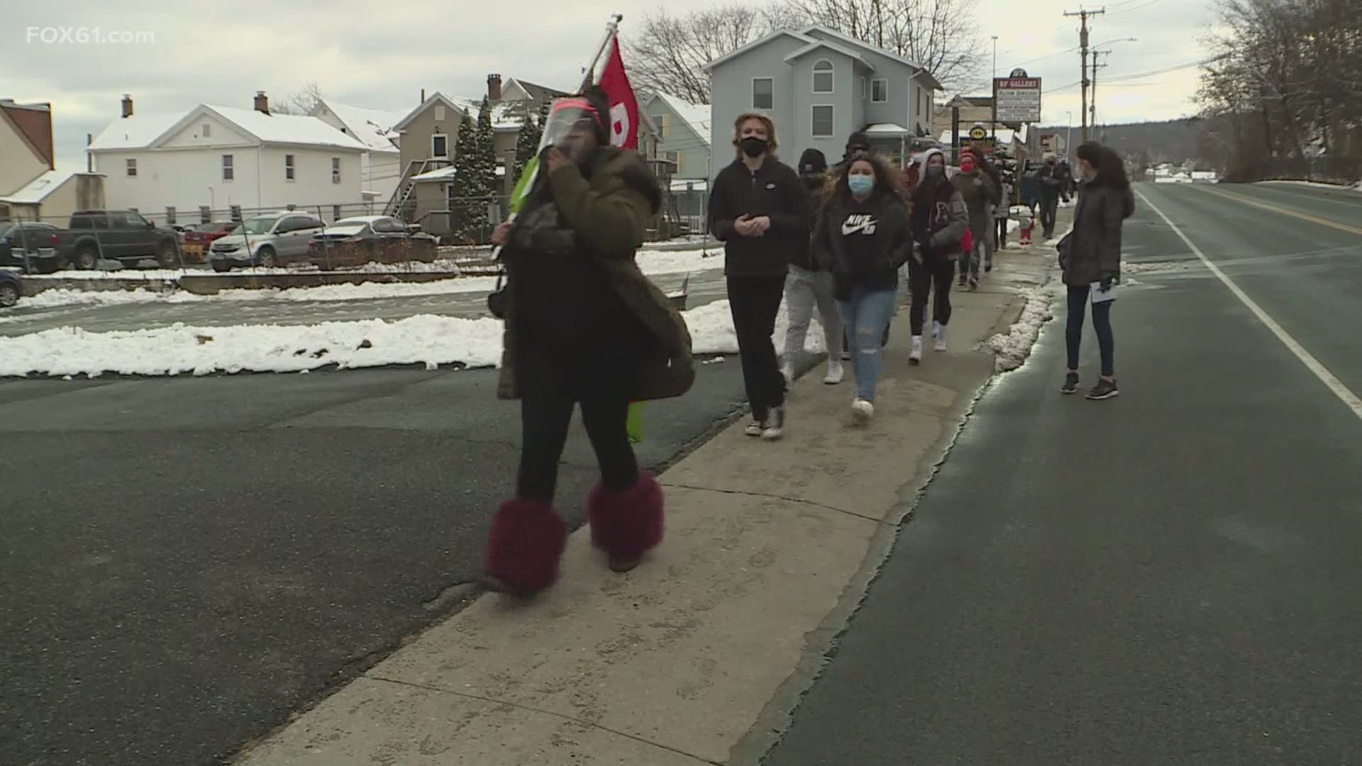 Members of the Naugatuck community participate in protest on town green after racist snapchat messages allegedly sent by the police chief’s daughter