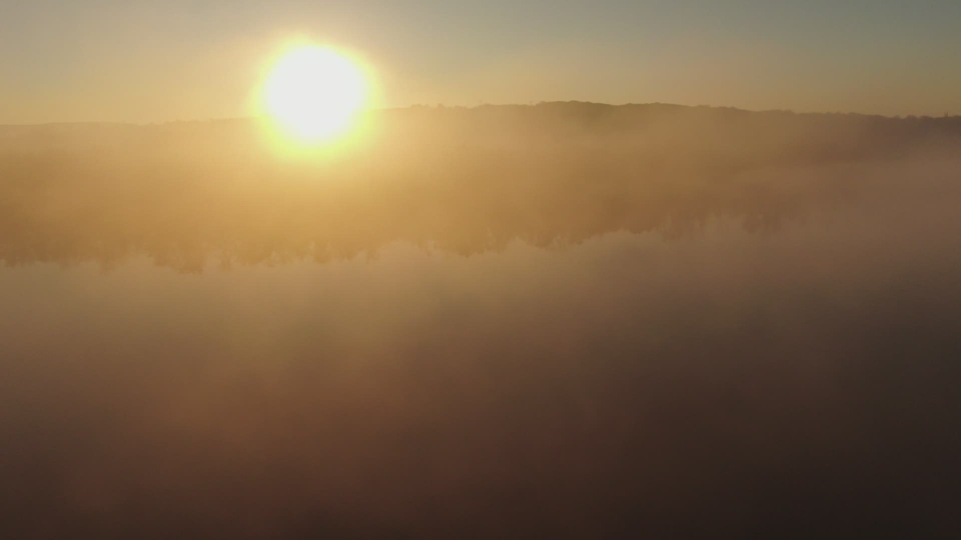 SKY61 flies over the Connecticut River in Cromwell capturing the early morning river fog