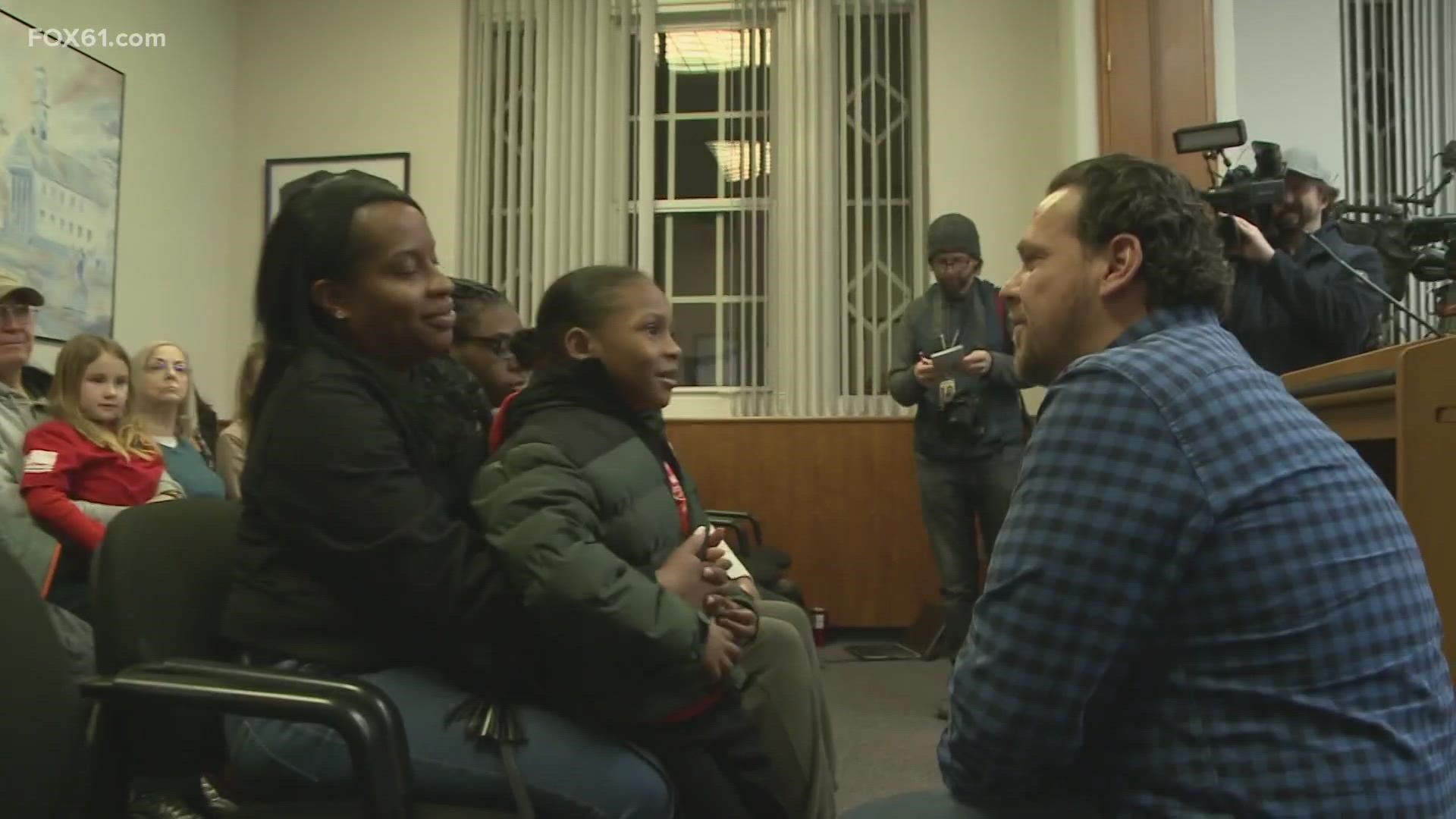 A Meriden family finally reunited with the men who saved their lives just weeks after their home burned down.