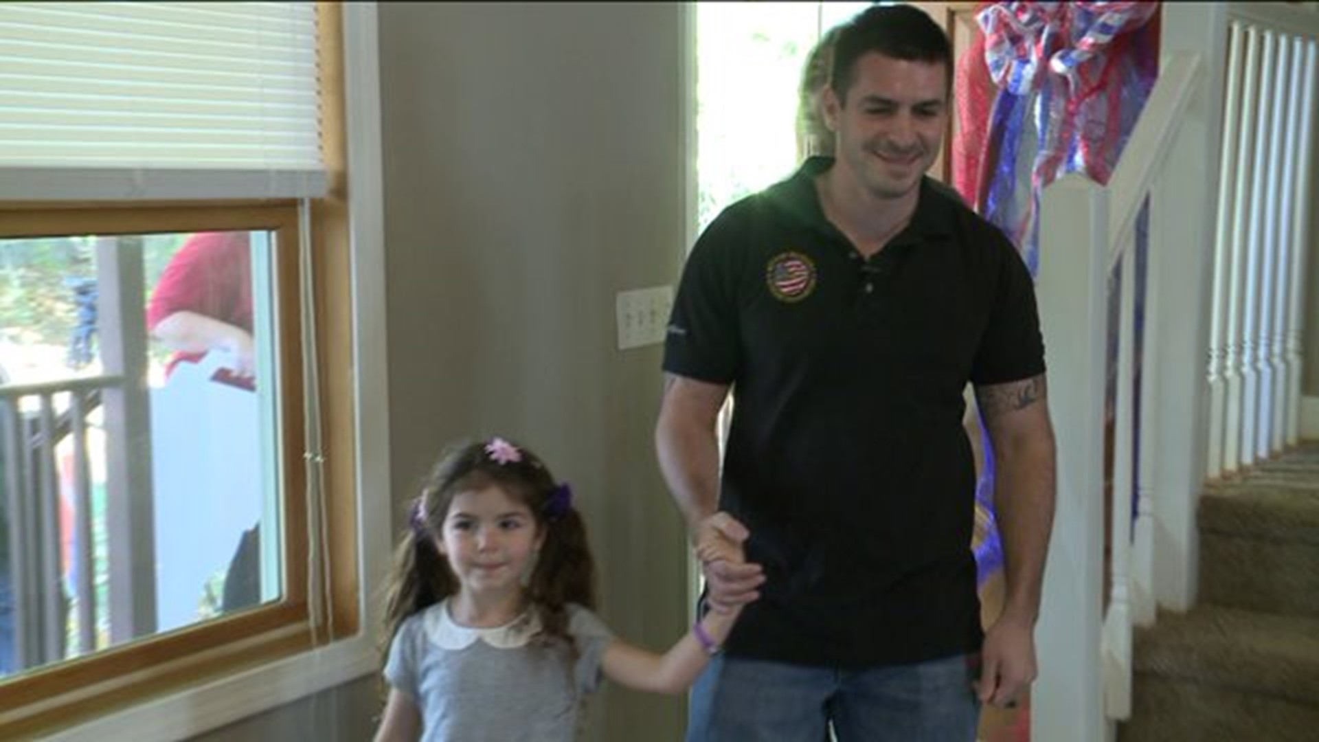 Military dad welcomed home with new house