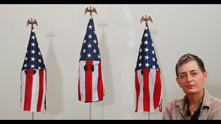 Professor's artwork turns U.S. flags into KKK-style hoods | fox61.com
