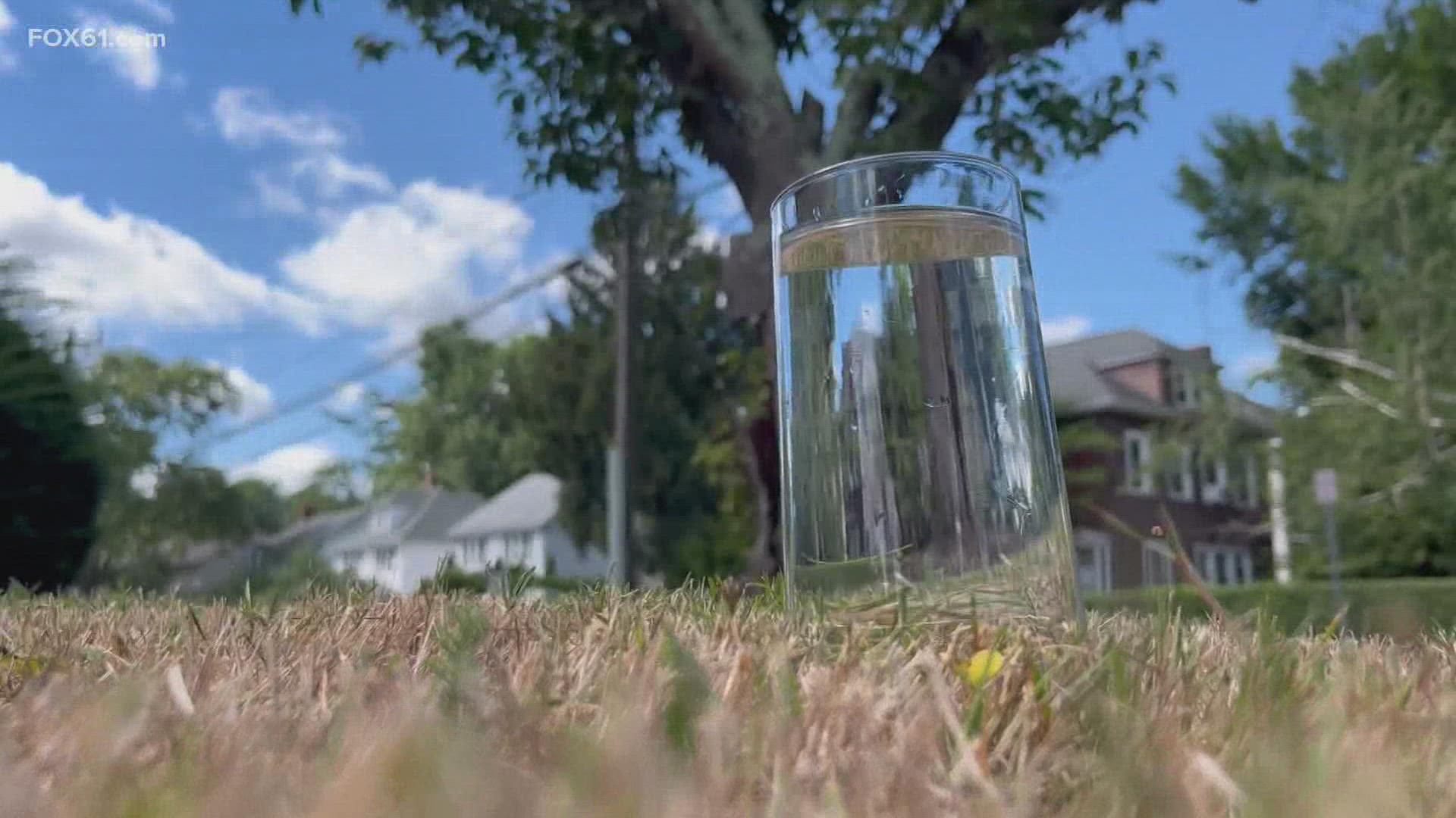 FOX61 Meteorologist Ryan Breton tested how fast dried-out grass and soil can absorb a glass of water after weeks of very little rain in Connecticut.