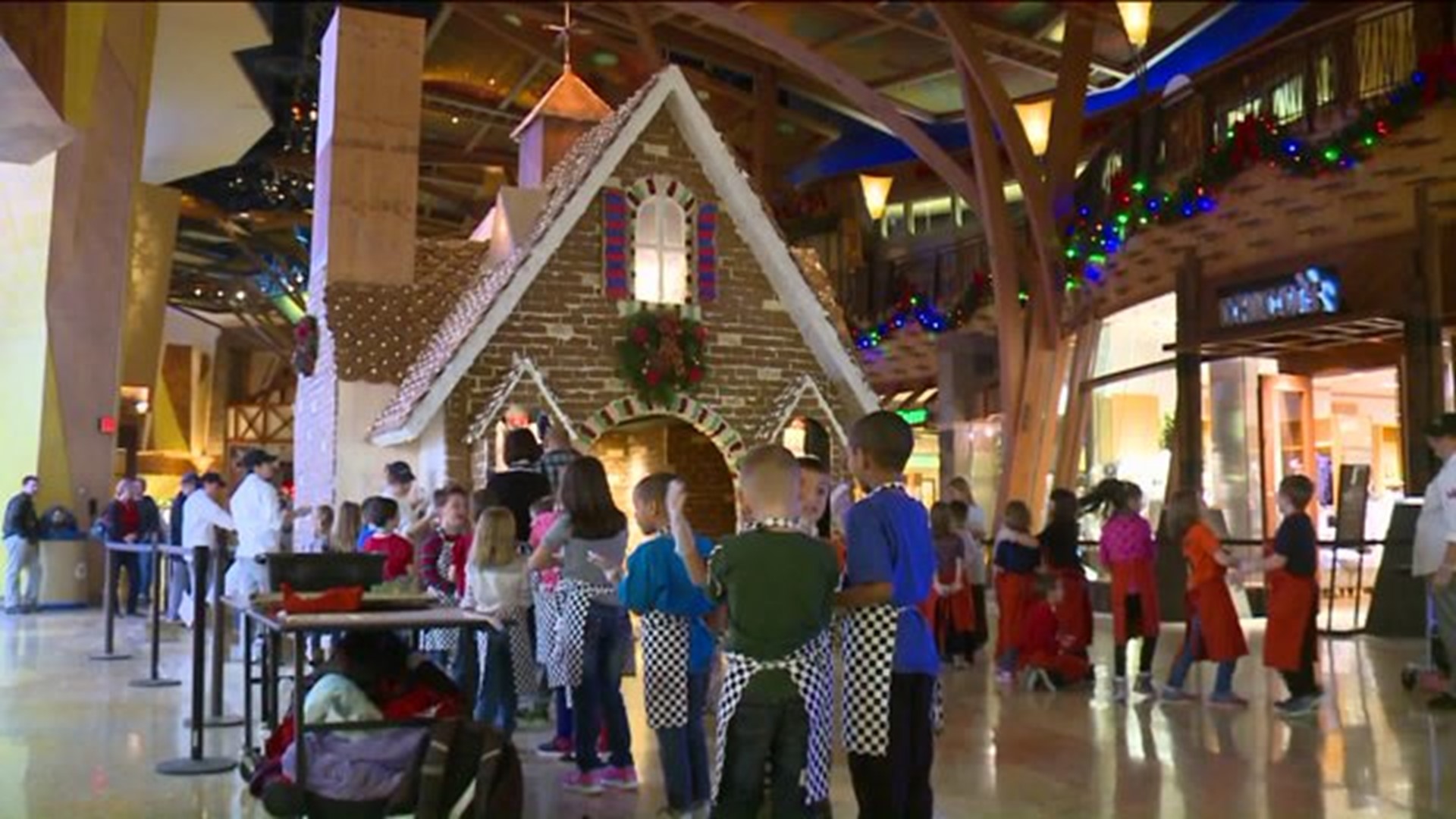 Kids help build life-size gingerbread house at Mohegan Sun