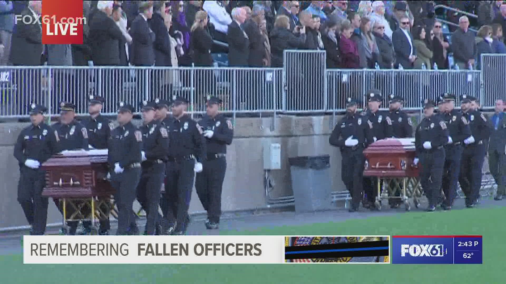 Amazing Grace plays as fallen Bristol police officers carried out from their joint funeral services.