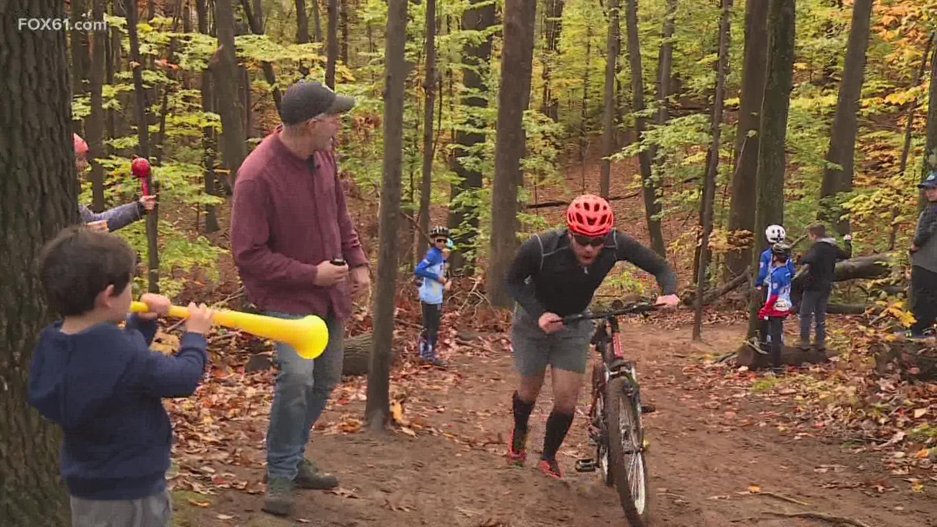 Participants follow a 1.5 mile dirt path where they loop around the course up to a dozen times -- and get heckled as they carry their bikes over obstacles.