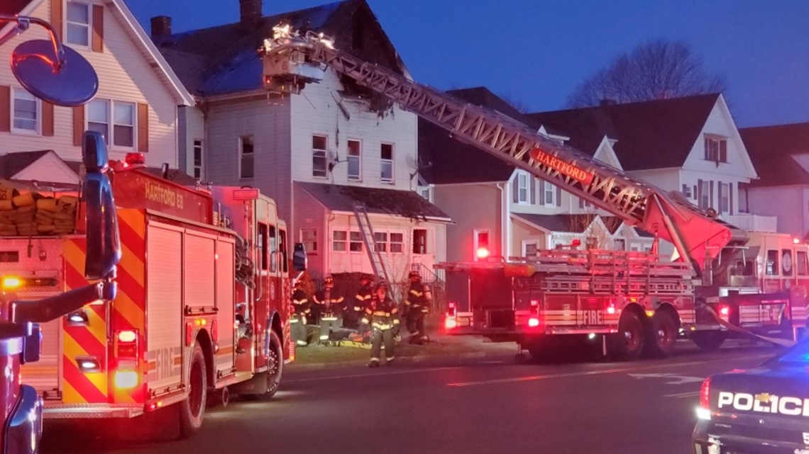 Firefighters battle house fire in Hartford