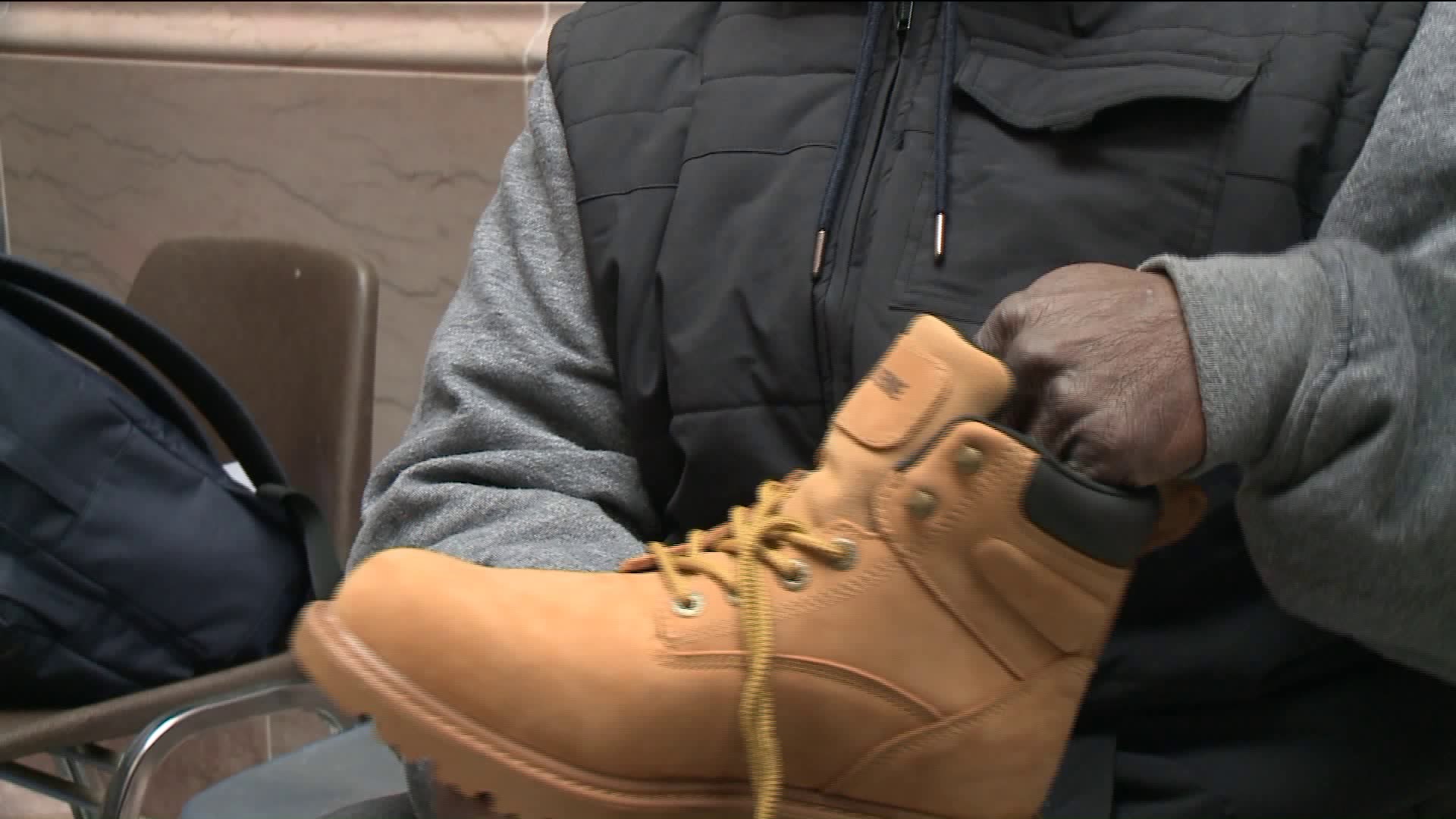 Volunteers hand out winter boots at the Hartford Winter Boot Party