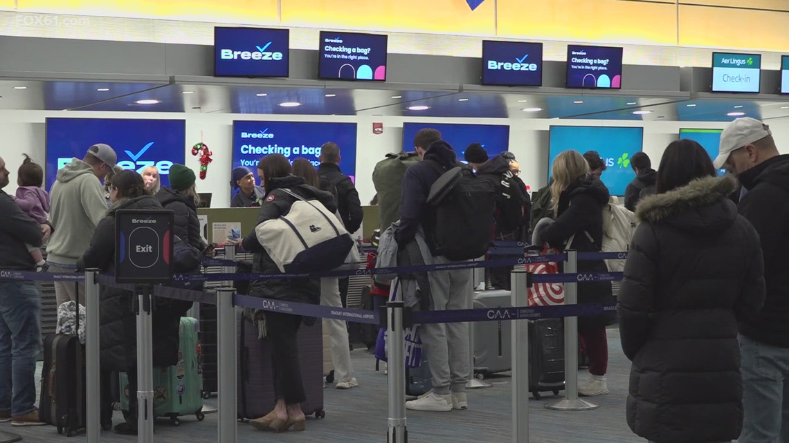 Passengers, families react to holiday season travel delays at Connecticut airport
