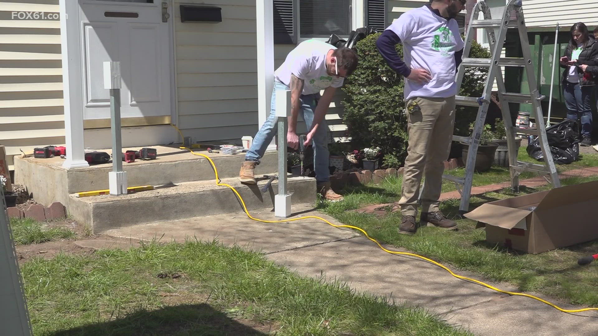 In Hartford, 14 homeowners are getting their homes renovated for free as part of National Rebuilding Day, where hundreds of volunteers complete repair projects.