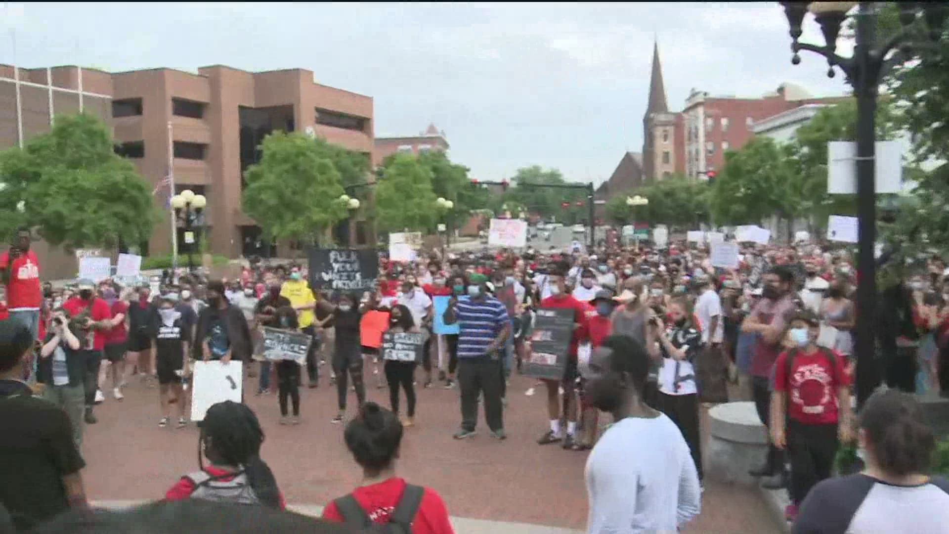 Hundreds gather outside the New Britain Police Department Friday to protest police brutality.