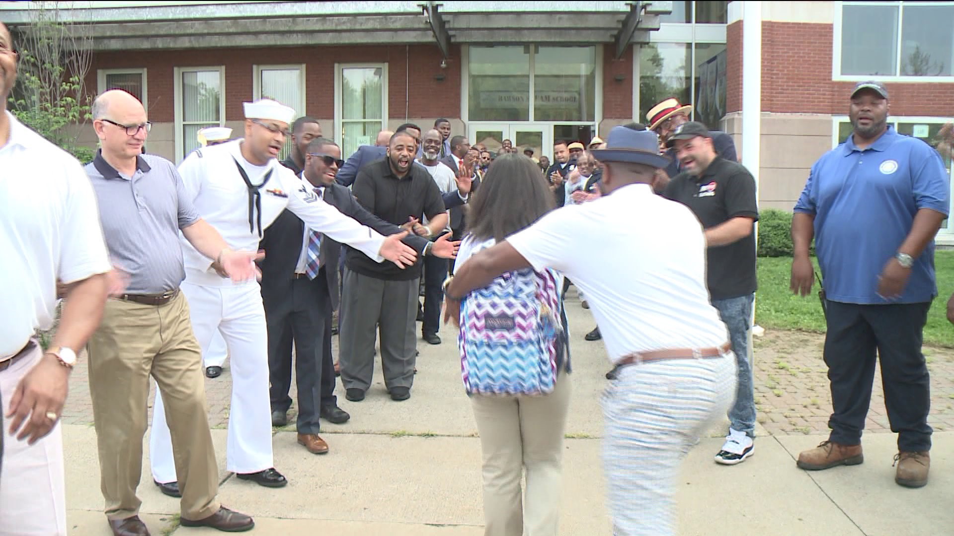 Community members greeting students at Hartford`s Rawson Elementary