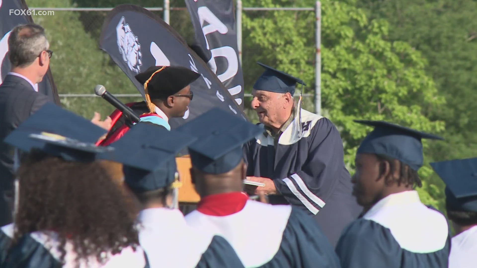In a sea of blue and white regalia, one graduate stuck out. Paul Panagrosso is a WWII Army veteran.