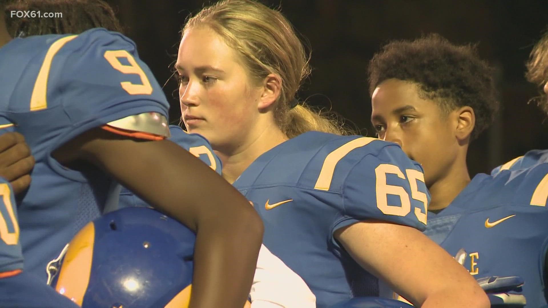 Molly Wilson honors her father by wearing the No. 65, which is the number he wore as an offensive and defensive tackle for Rockville High School in the early 1990s.