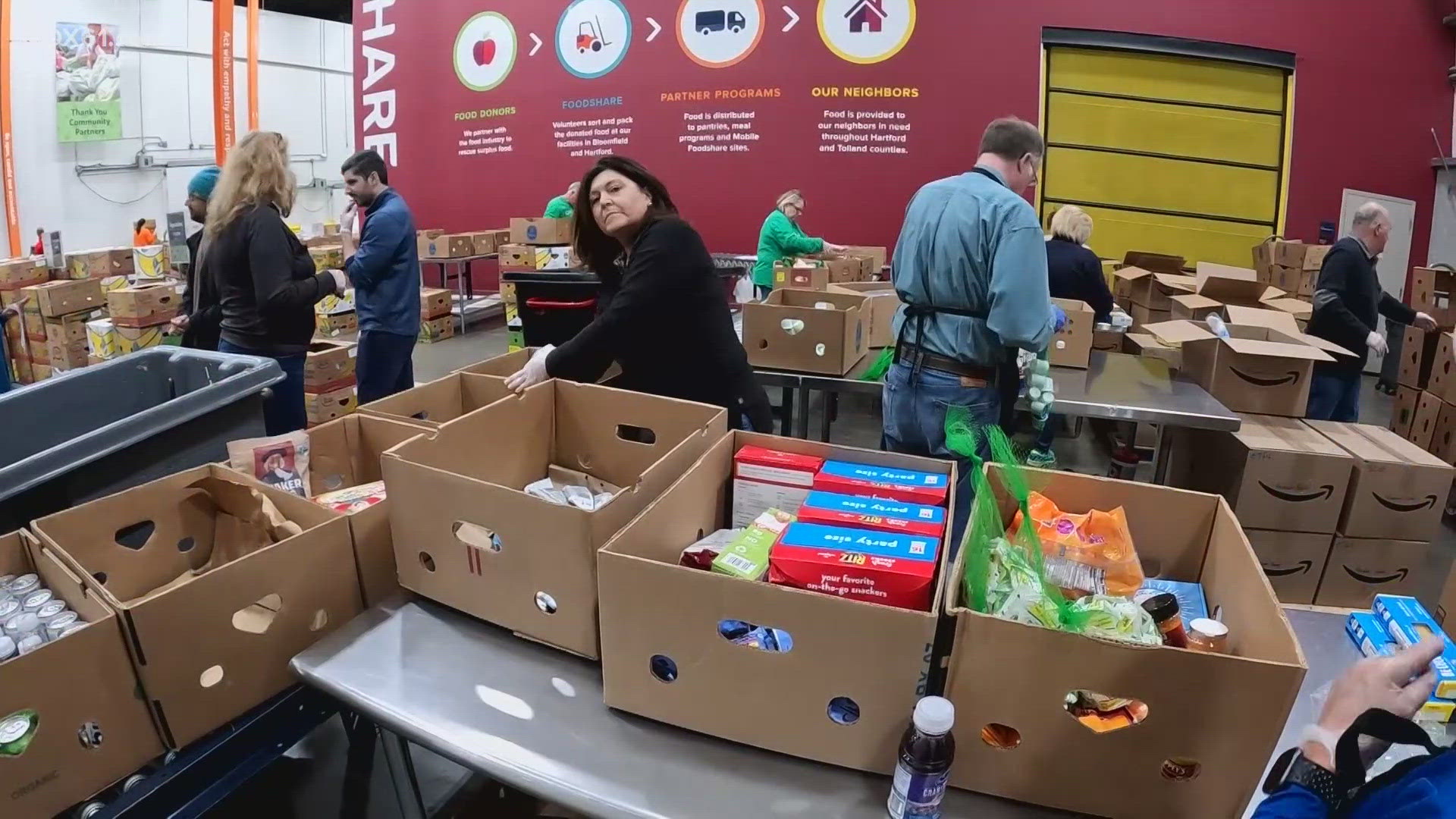 In Bloomfield at Connecticut Foodshare, volunteers spread smiles at a food bank to celebrate World Kindness Day.