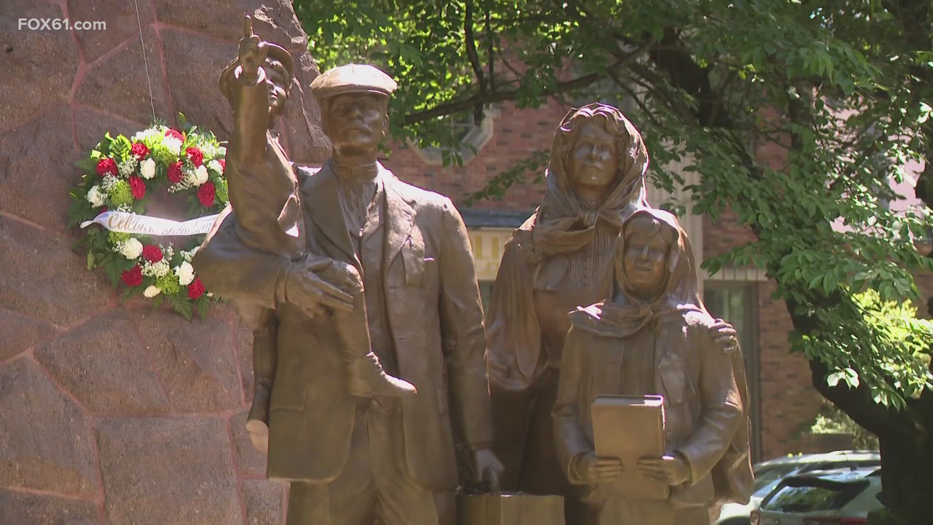The monument located in Wooster Square Park depicts a young immigrant family arriving in America.